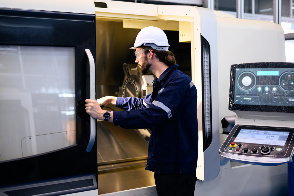engineer-mechanician-operating-and-controlling-cnc-2024-10-10-23-38-37-utc.jpg
